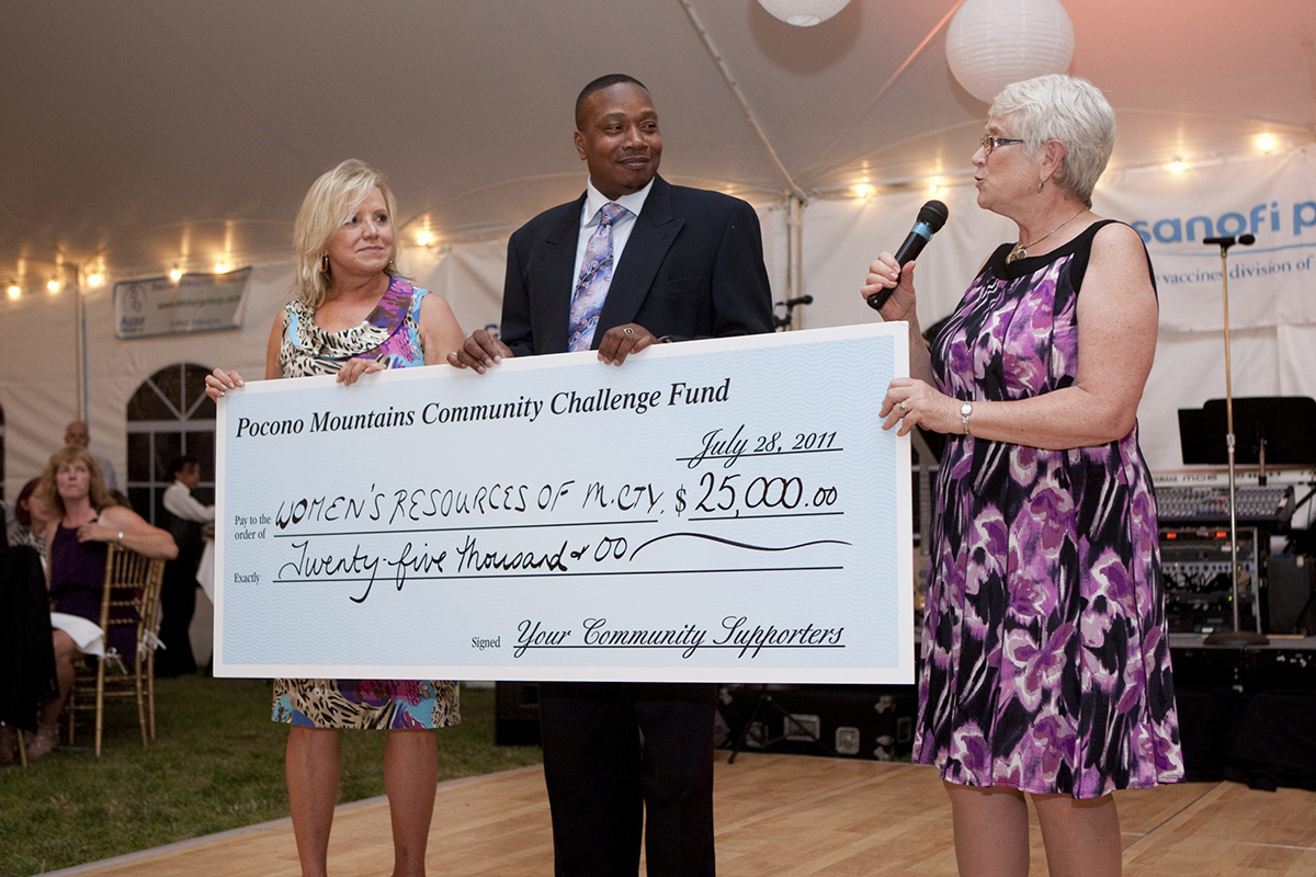 2011 check presentation to Women's Resources of Monroe County